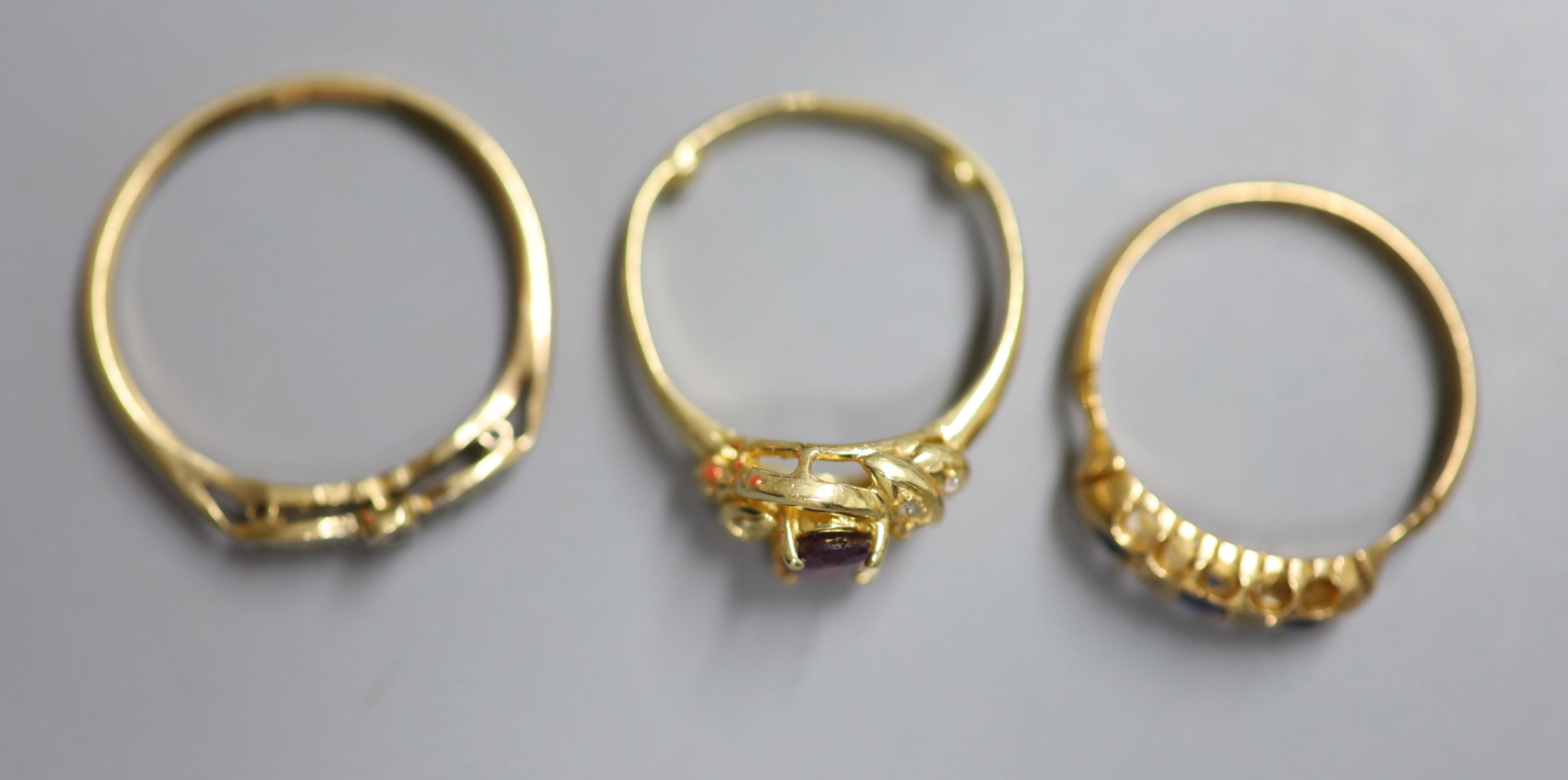 Three 18ct. rings